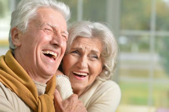 Home care services in Wirral. Domiciliary care and reablement. Elderly couple laughing.